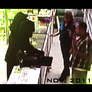 A couple dressed in black robs the Naughty By Night adult toy shop in a previous robbery in November 2011
