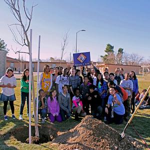 Volunteers pose next to a landscaping project at Mariposa Elementary School - courtesy of the City of Lancaster