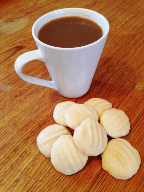 cup of coffee with bite sized butter sable biscuits recipe and easy method