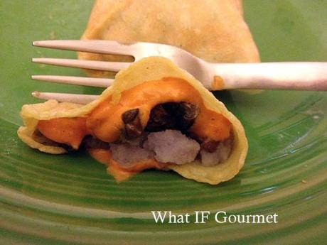 Gluten-free crepes stuffed with coarsely mashed purple potatoes, sauteed crimini mushrooms, and curried carrot dip.
