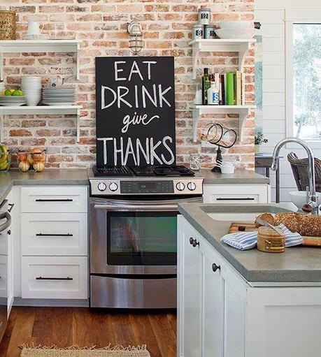 Kitchen Inspiration! Open up those shelves There's nothing in this kitchen that I don't love. I love the brick accent wall, the oversized chalkboard message, the open shelves, the white cabinetry...