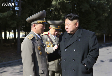 Kim Jong Un talks to SPA deputy candidate Maj. Gen. Kim Kwang Hyok, for whom KJU cast his ballot, in Pyongyang on 9 March 2014 (Photo: KCNA).