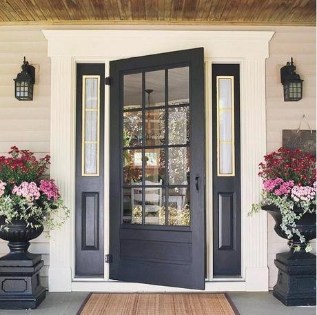 A Welcoming Front Door love the urns with flowers spilling over. great front door. like its a lighter shade of black and that its not high gloss