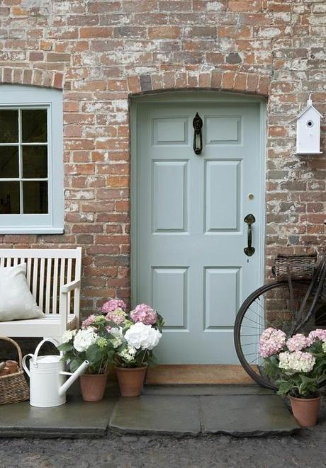 A Welcoming Front Door This color palette projects a warm and hospitable home just beyond this door.