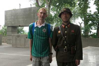 99 Things To Do in Pyongyang, North Korea Posing with a North Korean soldier.