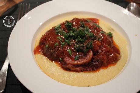 Tomato and red wine cooked osso bucco with creamy parmesan polenta