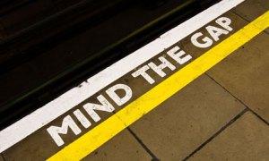 Mind the Gap sign on the edge of a London Underground Tube station's platform