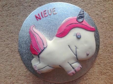 baby name cake nieve pink white and silver unicorn