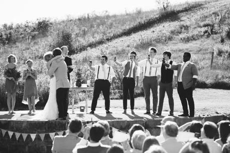 bridal party takes picture during wedding