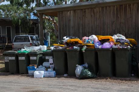 overflowing rubbish bins at caravan park