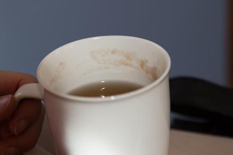 white tea cup with stained rim inside