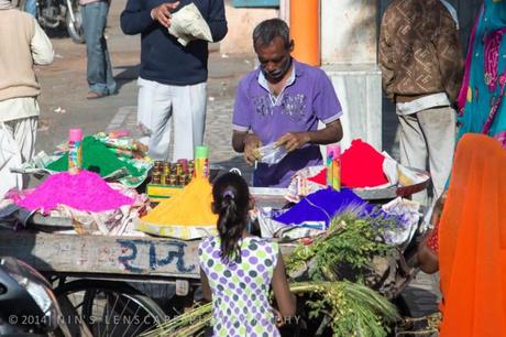 People in the market in Jaipur selling the color powder....