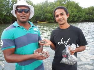 Dion Harrigan (left) and Chef Desi Bahnan with cockles they found in saltwater lagoon near Hermitage Bay in Antigua