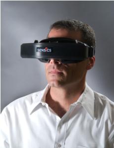 photo of human wearing virtual reality headgear