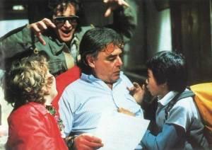 Steven-Spielberg-trying-to-scare-Richard-Donner-as-hes-talking-to-Jeff-Cohen-and-Jonathan-Ke-Quan-on-the-set-of-The-Goonies