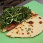 Flatbread, variety of local lettuce and proscuitto