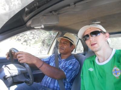 Backpacking in East Timor: Visiting the Jesus Statue at Cape Fatucama In the taxi with Johnny my taxi driver!