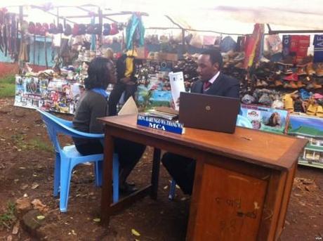 Kenya’s Democratic Experiment in Devolution A member of one of Kenya's new county assemblies sets up an office in an open-air market outside of Nairobi. (Photo: VOA News)