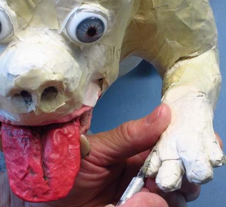  paper mache dog- slits for claws