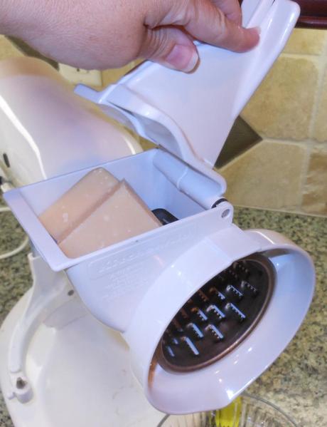 I have this fancy contraption.  It's a slicer/shredder attachment for my Kitchen-aid mixer.  As I get older, it hurts to grate cheese, so I got this with some Kohl's cash.  I use it almost every week!