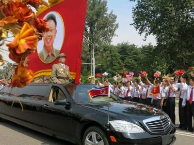 9th September 2013: National Day Parade in Pyongyang, North Korea A Kim Jong Il flag on one of the first cars that came past