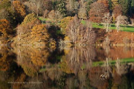 Landscape photo - autumnal reflections in Loch Yummel, Perthshire Scotland