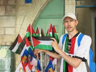 World Borders: How to Get from Jerusalem to Bethlehem (Israel to Palestine) Posing with the Palestine Flag - don't forget where you are when you end up in Bethlehem.
