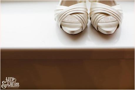 Photo of brides shoes at wedding preparation