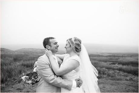 bride and groom embrace out on the west yorkshire moors