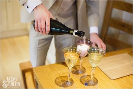 groomsmen poor champagne at yorkshire wedding