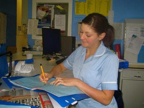 The Top Four States to Start a Nursing Career Staff_Nurse_Andrea_writing_up_her_notes