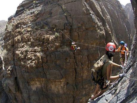 Photo: Hikers on rocks in Oman