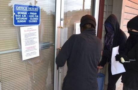 Northern Gateway Pipeline Protesters Lock Doors To Tory MP Offices Locking the doors, June 24, 2014. Photos by Murray Bush-Flux Photos.
