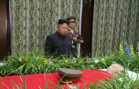 Kim Jong Un stands in front of Jon Pyong Ho's casket at the Sojang Club in Pyongyang on 9 July 2014 (Photo: Rodong Sinmun).