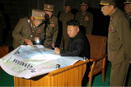 Kim Jong Un is briefed about a rocket drill by the KPA Strategic Forces (Photo: Rodong Sinmun).
