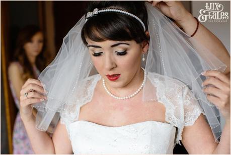 Bride puts on veil at hope strett hotel wedding photography