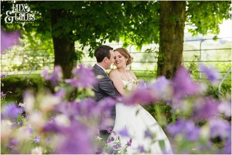 Relaxed informal documentary wedding photography at Taitlands behind flowers