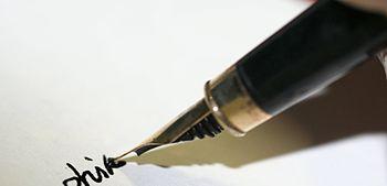 Image of a modern fountain pen writing in curs...
