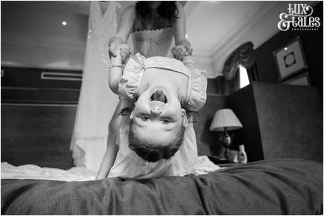 Leeds Club Wedding Photography Bride plays with daughter silly faces
