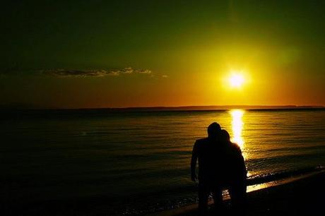 couple watching sunset together