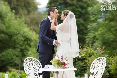 Broadoaks Wedding Photographer Windermere || Tux & Tales Photography || outside ceremony on lawn first kiss