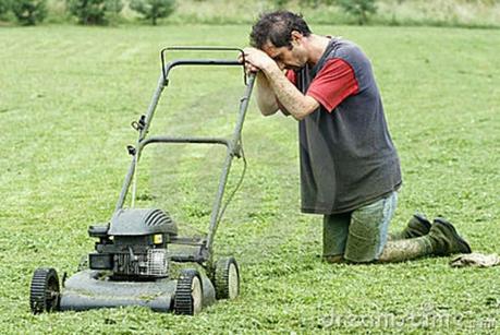 man praying to lawn mower
