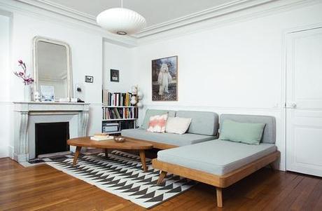 Living room with geometric rug and gray convertible sofa