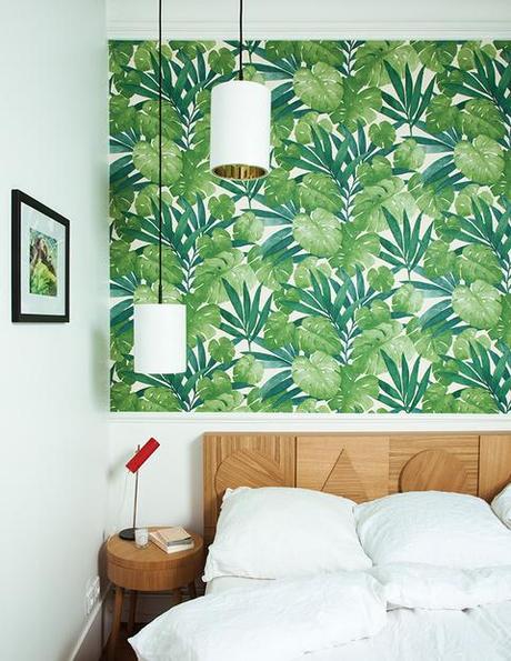 Wooden geometric headboard with green plants wallpaper