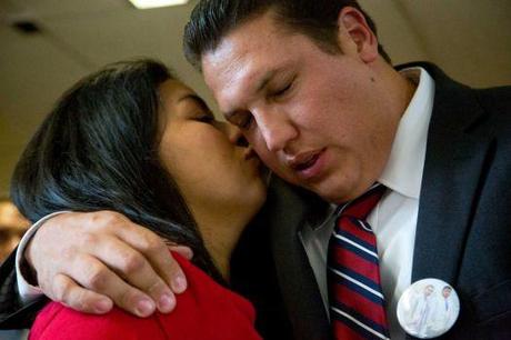 After being acquitted for murder (right) David Barajas hugs and gets a kiss from his wife (left) Cindy Barajas while addressing the media at the Brazoria County courthouse Wednesday August 27, 2014. David Barajas, 32, was accused of shooting Jose Banda, 20, after he struck his two sons, aged 11 and 12, on a rural Texas road in 2012. Photo: Billy Smith II, Chronicle / © 2014 Houston Chronicle