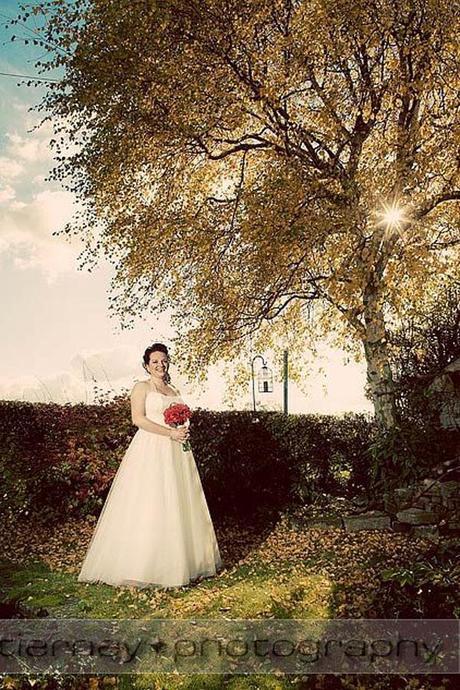 Gorgeous portrait photo of bride Emma - I love the sunlight peeking between the leaves