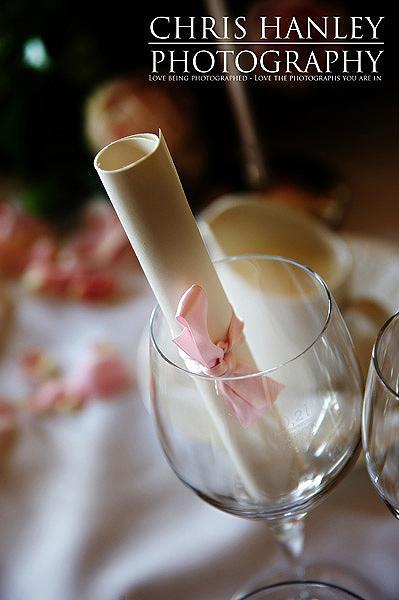 Lovely little rolled scroll wedding favours with pink ribbon