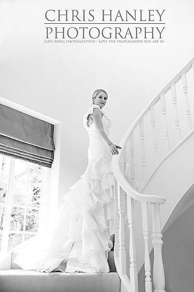 The bride: Amy is so very, very beautiful. I love the stairway with light above and behind her - and the wedding dress looks out of this world.