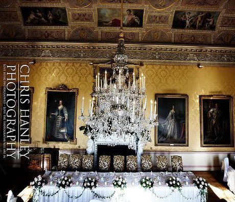 The top table and magnificent chandelier; ancestral portraits watch over the celebrations