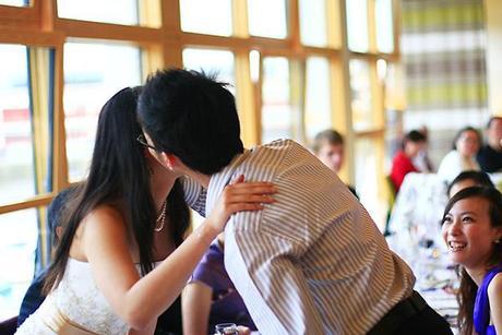 Male guest kissing the bride...